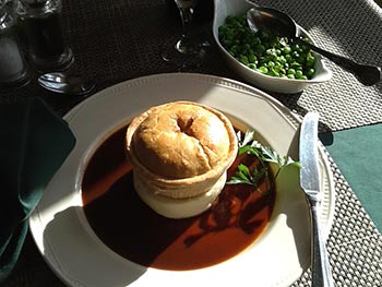A Paysanne dish served with peas and sauce